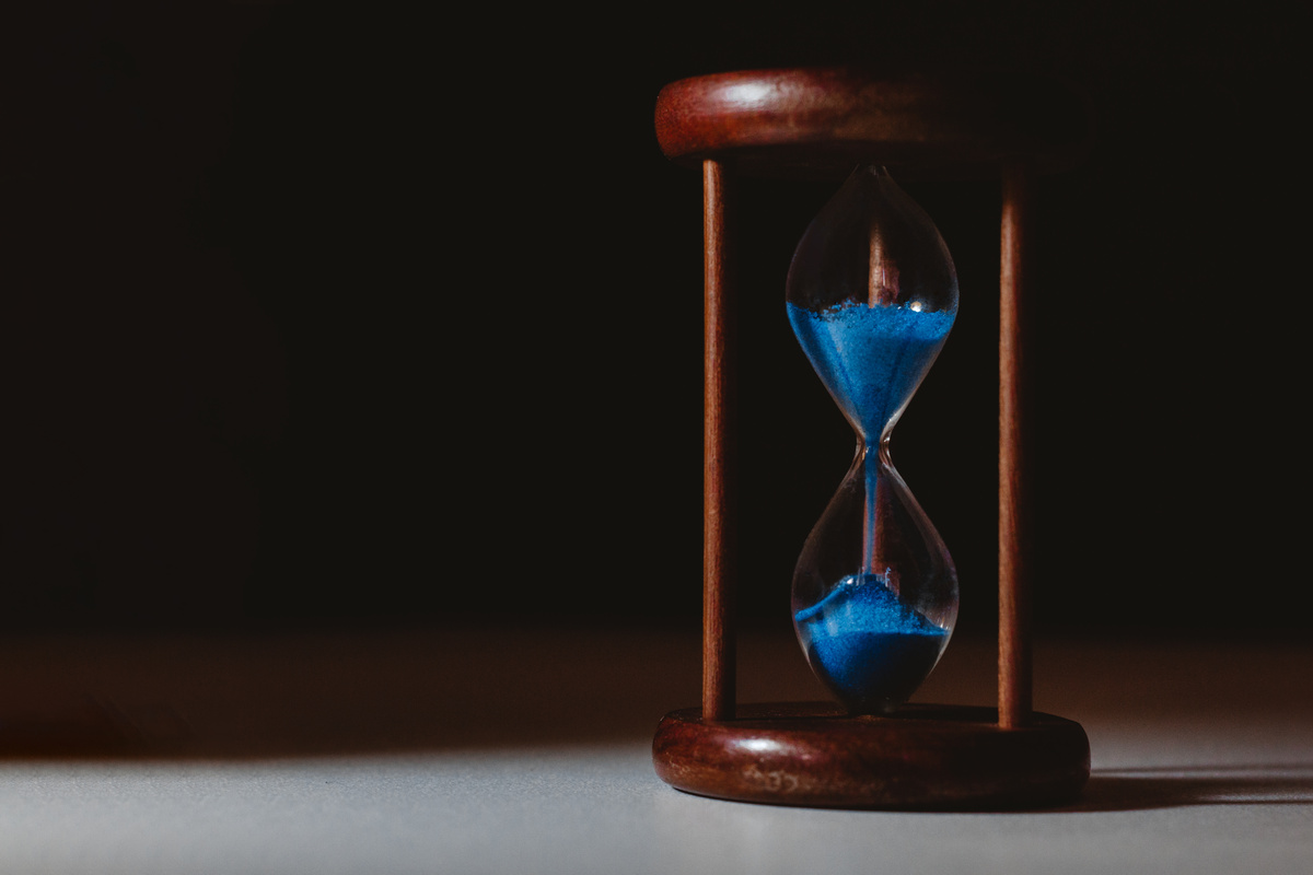 Hourglass on Brown Wooden Frame